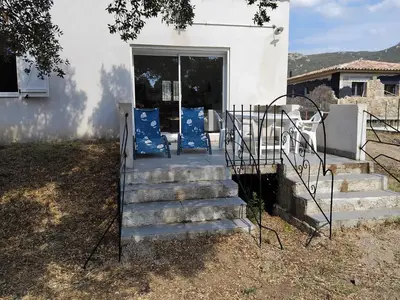 a set of stairs leading to a house at villa au calme à Figari in Figari