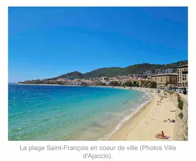 a beach with a group of people in the water at AJACCIO Hyper centre Fesch in Ajaccio