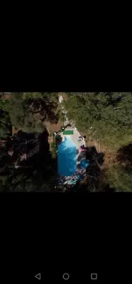 an aerial view of a blue object in a field at La licorne in Serriera