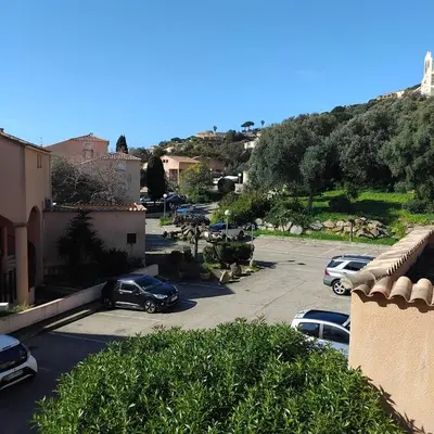 a group of cars parked in a parking lot at Le Scudo in Ajaccio