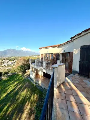 a balcony of a house with a fence at Villa en pierre Vue imprenable sur le Golfe in Propriano