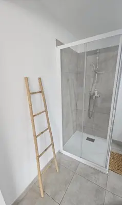 a ladder in a bathroom with a shower at Studio 2 minutes du port Bonifacio avec parking privé in Bonifacio