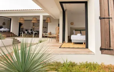 a house with a bedroom and a living room at Villa MIASULI, Domaine privé, Piscine chauffée, À 10 min de la plage in Sainte-Lucie de Porto-Vecchio