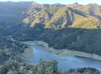 an aerial view of a lake in the mountains at Chioselle in Chiatra