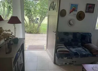 a bedroom with a bed and a door to a yard at Chioselle in Chiatra