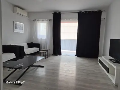 a bedroom with a bed and a wooden floor at Ajaccio in Ajaccio