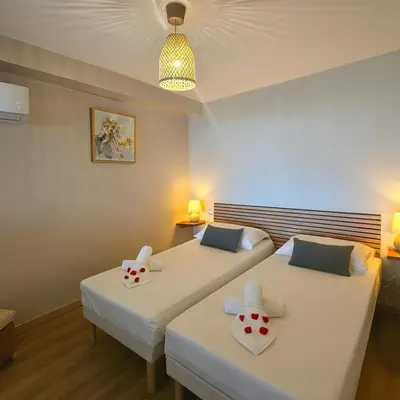 two beds in a room with two bedsvisor at Sublime Appartement neuf climatisé vue imprenable sur la mer terrasse wifi in Serra-di-Ferro