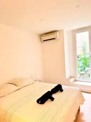 a bed with two pairs of glasses on it at Appartement hyper centre 100m de la plage in Ajaccio