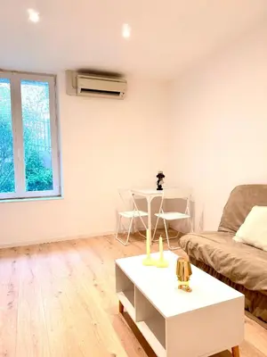 an empty hallway with white walls and a wooden floor at Appartement hyper centre 100m de la plage in Ajaccio