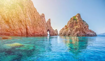 a view of a large rock formation in the water at L'Onda Serena - 4 couchages à 5 min de la plage in Ajaccio