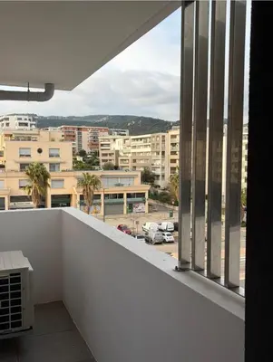 a balcony with a view of a city at L'Onda Serena - 4 couchages à 5 min de la plage in Ajaccio