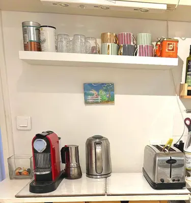 a kitchen counter with a toaster and a microwave at San Ciprianu-Lecci House, seaside, beach 2'' in Lecci
