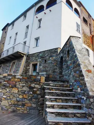 a building with stairs leading up to it at Saint Christophe in Omessa