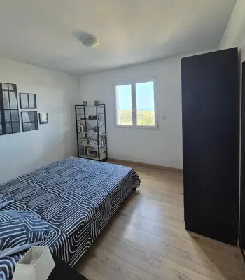 a bedroom with a bed in a room at T2 vue mer in Chiatra