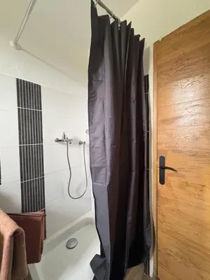 a bedroom with a table and a bed and a table at Bienvenue chez vous ! in Ajaccio
