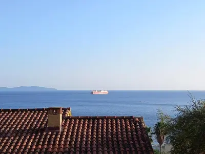 a black refrigerator with a microwave on top of it at T1B 41 m2 sea view Îles Sanguinaires beaches within walking distance in Ajaccio