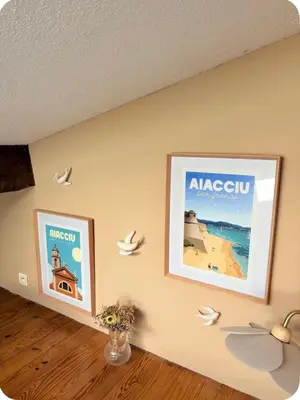 a room with two pictures on the wall at Studio 1er Consul in Ajaccio