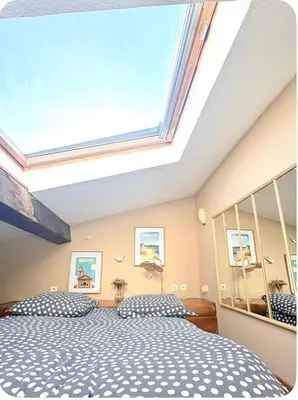 a bedroom with a large mirror and a bed at Studio 1er Consul in Ajaccio