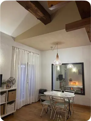 a living room with a staircase and a bedroom at Studio 1er Consul in Ajaccio