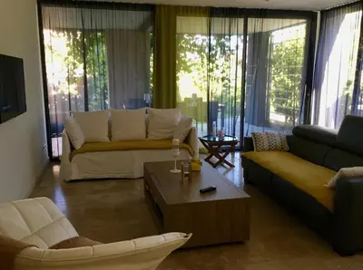 a living room with a couch and a coffee table at A Casa Nèra in Porto Pollo