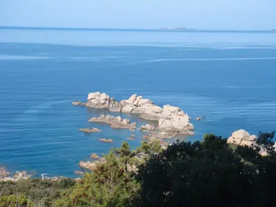 a group of rocks in the middle of the water at Villa avec piscine et belle vue mer proche des plages et commerces in Porticcio