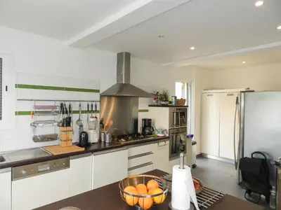 a kitchen with a bowl of oranges on a table at Villa Fidiamare by Interhome in Galeria