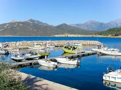 a group of boats docked at a dock in the water at Villa Fidiamare by Interhome in Galeria