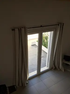 a sliding glass door with a view of a patio at U-Casone in Linguizzetta