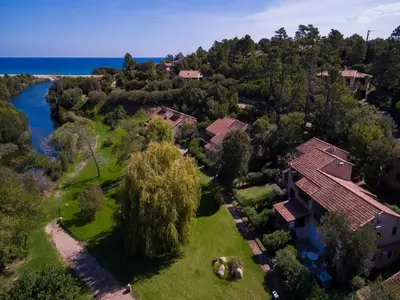 an aerial view of a house and a river at Lavu Santu in Sainte-Lucie de Porto-Vecchio