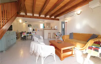 a living room with a couch and a table at Nice Home In Prunete With Wifi in Prunete