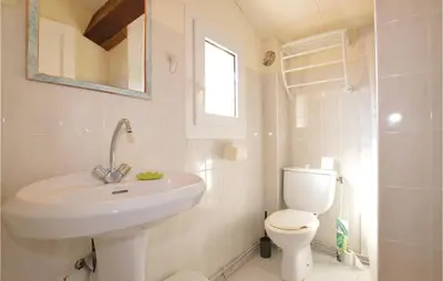 a white bathroom with a sink and a toilet at Nice Home In Prunete With Wifi in Prunete