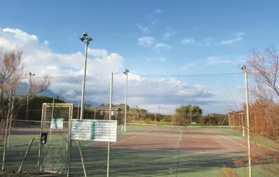 a tennis court with a net on a tennis court at Nice Home In Prunete With Wifi in Prunete