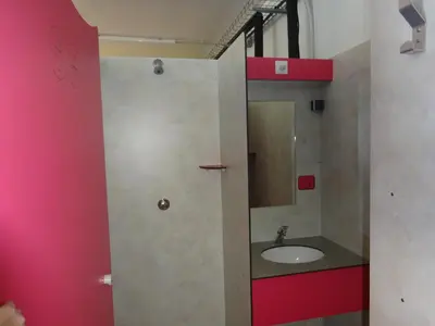 a bathroom with a sink and a mirror at Camping Mozziconaccio in Sainte-Lucie de Porto-Vecchio