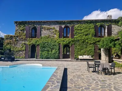 a house with a swimming pool in front of it at U Palazzu - Demeure de charme au centre de la Corse in Corte