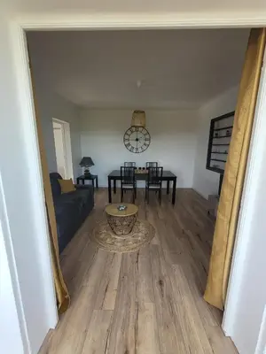 a living room with a couch and a table at Gîte Tomasini in Monacia-dʼAullène