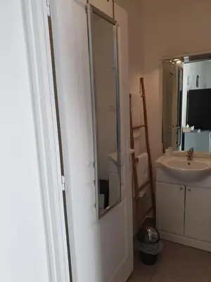 a bathroom with a sink and a glass shower at Casa Petra in Corte