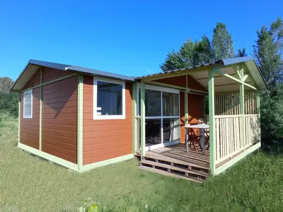 a house with a deck with a table on it at Perula di Machja in Alata