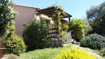 a small house with a gate and a fence at Maison Alba Rossa 56 in Serra-di-Ferro