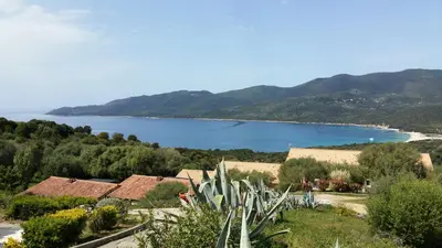 a view of a body of water from a hill at Maison Alba Rossa 56 in Serra-di-Ferro