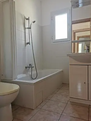 a white bathroom with a tub and a sink at Terres de France - Les Hauts du Maquis in Linguizzetta