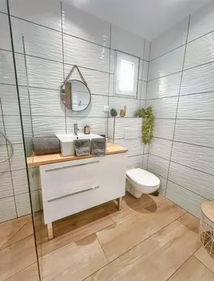 a bathroom with a sink and a toilet at Chambres Isula Bella in Figari