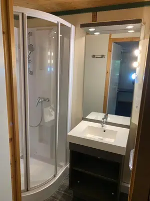 a bathroom with a shower and a sink at L'Aravone Lodge in Sartène