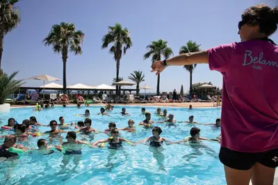 a group of people in a swimming pool at Belambra Clubs Borgo - Pineto in Borgo