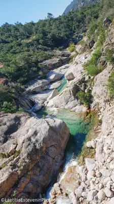 an aerial view of a river on a rocky hillside at Le Chalet de Valentine & Laurent in Olmiccia