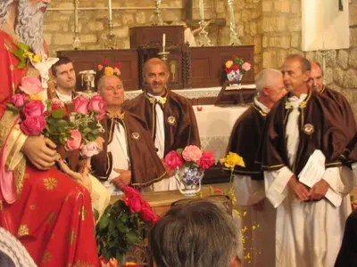 a group of people standing in a church at Le Chalet de Valentine & Laurent in Olmiccia
