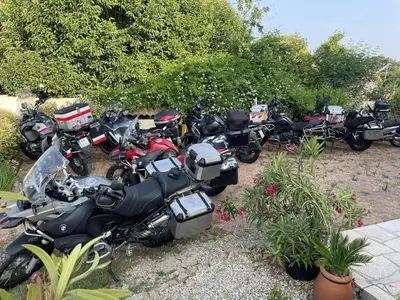 a group of motorcycles parked in a row at House Angeli in Prunelli-di-Fiumorbo