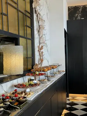 a counter with flowers in vases on it at Hotel San Carlu Citadelle Ajaccio in Ajaccio