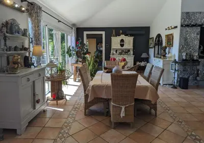 a kitchen and dining room with a table and chairs at Villa Mimosa in Favone