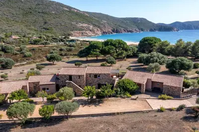 an aerial view of a house next to the ocean at U Casinu in Piana