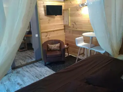 a bedroom with a couch and a chair and a table at Villa Praesidio in Riventosa